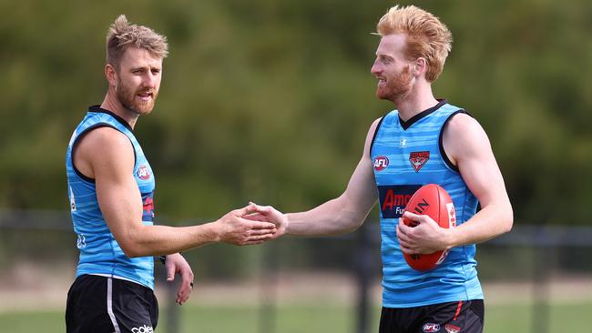MELBOURNE. 19/11/2021. Essendon training at Tullamarine. Dyson Heppell and Aaron Francis ... Photo by Michael Klein.