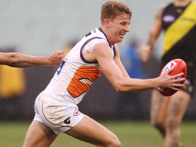 MELBOURNE, AUSTRALIA - JULY 14: Lachie Whitfield of the Giants runs with the ball during the round 17 AFL between the Richmond Tigers and the Greater Wester Giants at Melbourne Cricket Ground on July 14, 2019 in Melbourne, Australia. (Photo by Michael Dodge/Getty Images)