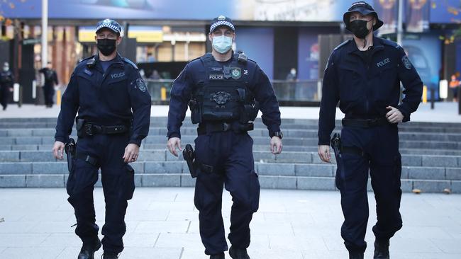 Police patrol around train stations in the city. Picture: David Swift
