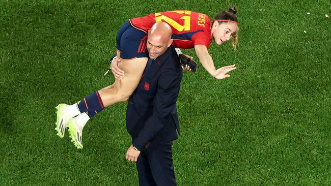 Rubiales, the federation president, throws Athenea del Castillo Beivide over his shoulder. Picture: David Gray/AFP