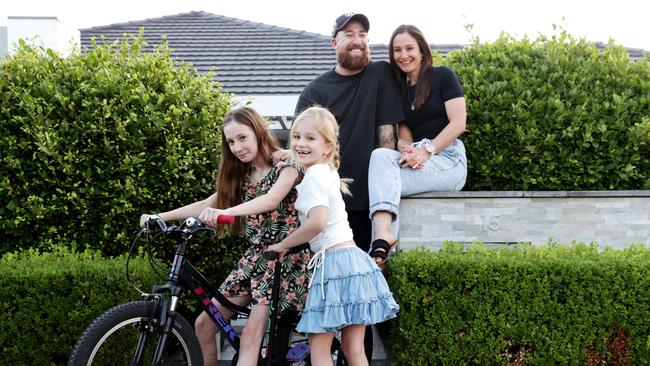 Joinery manager and property investor Anthony Weiley with wife Sam and daughters Ella, 10, and Halle, 6, at their home in Sydney. Picture: Jane Dempster