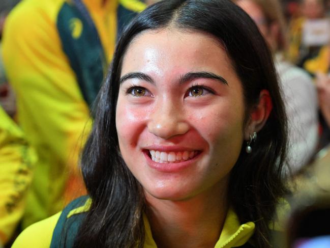 Australian gold medallist skateboarder Arisa Trew smiles as disembarks a chartered flight following Australian athletes return from the Paris 2024 Olympic Games, at the Sydney International Airport on August 14, 2024. (Photo by Saeed KHAN / AFP)