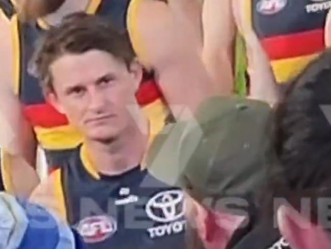 The video showing the alleged incident of Matt Crouch knocking off a football fans hat after the Showdown  .  Picture: 7NEWS