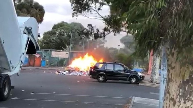 A rubbish truck forced to dump its load outside the Northcote aquatic centre this morning. Picture: Tracey Linguey