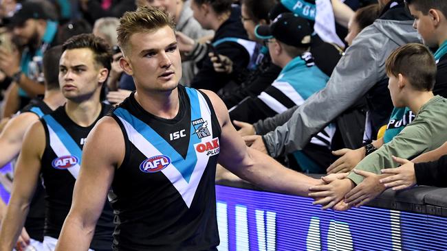 Ollie Wines celebrates with Port fans after a win. Picture: AAP Images