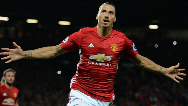 (FILES) This file photo taken on August 19, 2016 shows Manchester United's Swedish striker Zlatan Ibrahimovic celebrates after scoring their second goal from the penalty spot during the English Premier League football match between Manchester United and Southampton at Old Trafford in Manchester, north west England, on August 19, 2016. Zlatan Ibrahimovic has rejoined Manchester United on a one-year contract on August 24, 2017 after the Swedish star's spell with the Premier League side was curtailed by a serious knee injury last season. Ibrahimovic missed the final weeks of United's campaign after suffering ligament damage in a Europa League clash against Anderlecht in April 2017.  / AFP PHOTO / Oli SCARFF / RESTRICTED TO EDITORIAL USE. No use with unauthorized audio, video, data, fixture lists, club/league logos or 'live' services. Online in-match use limited to 75 images, no video emulation. No use in betting, games or single club/league/player publications.  /