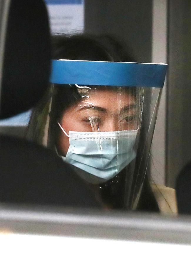 Sarah Caisip on her way to view her father’s body after his funeral at Mt Gravatt Cemetery. Picture: Annette Dew