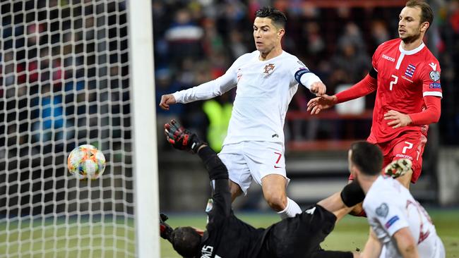 Portugal Cristiano Ronaldo, centre, scores against Luxembourg. Picture: AFP