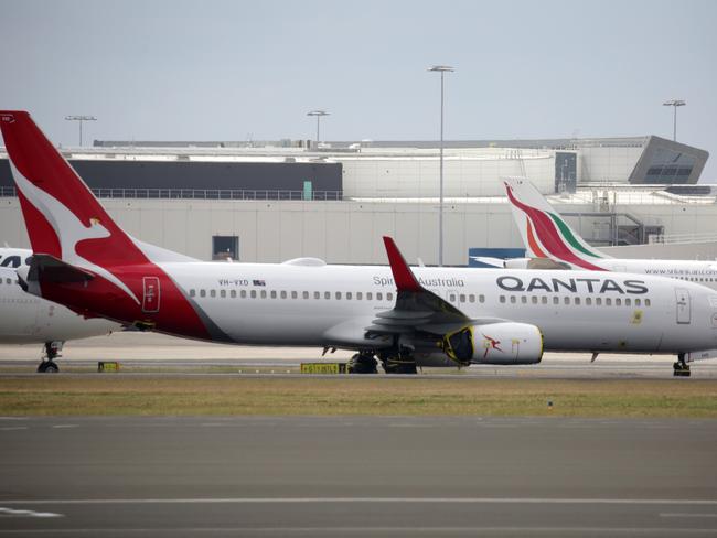 SYDNEY, AUSTRALIA - NewsWire Photos OCTOBER 08, 2020 - A Qantas plane on the tarmac at Sydney Airport on Thursday October 08, 2020.Picture: NCA NewsWire / Christian Gilles