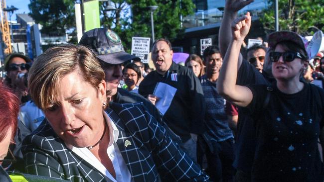 Christine Forster is caught up in a crowd of protesters outside the fundraising event. Picture: AAP