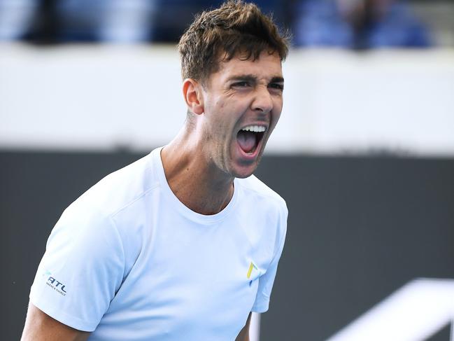 ADELAIDE, AUSTRALIA - JANUARY 12: Thanasi Kokkinakis of Australia celebrates winning the match against John Isner of USA during day four of the 2022 Adelaide International at Memorial Drive on January 12, 2022 in Adelaide, Australia. (Photo by Mark Brake/Getty Images)