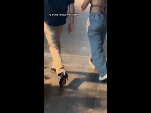 Sydney man switches into partner's heels to save her sore feet
