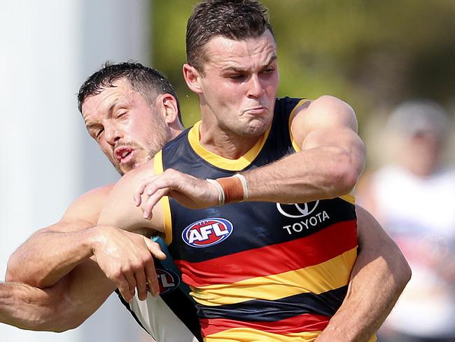 AFL - 02/03/19 - JLT Series - Crows v Port Adelaide at Port Pirie. Brad Crouch under pressure from Travis Boak. Picture SARAH REED