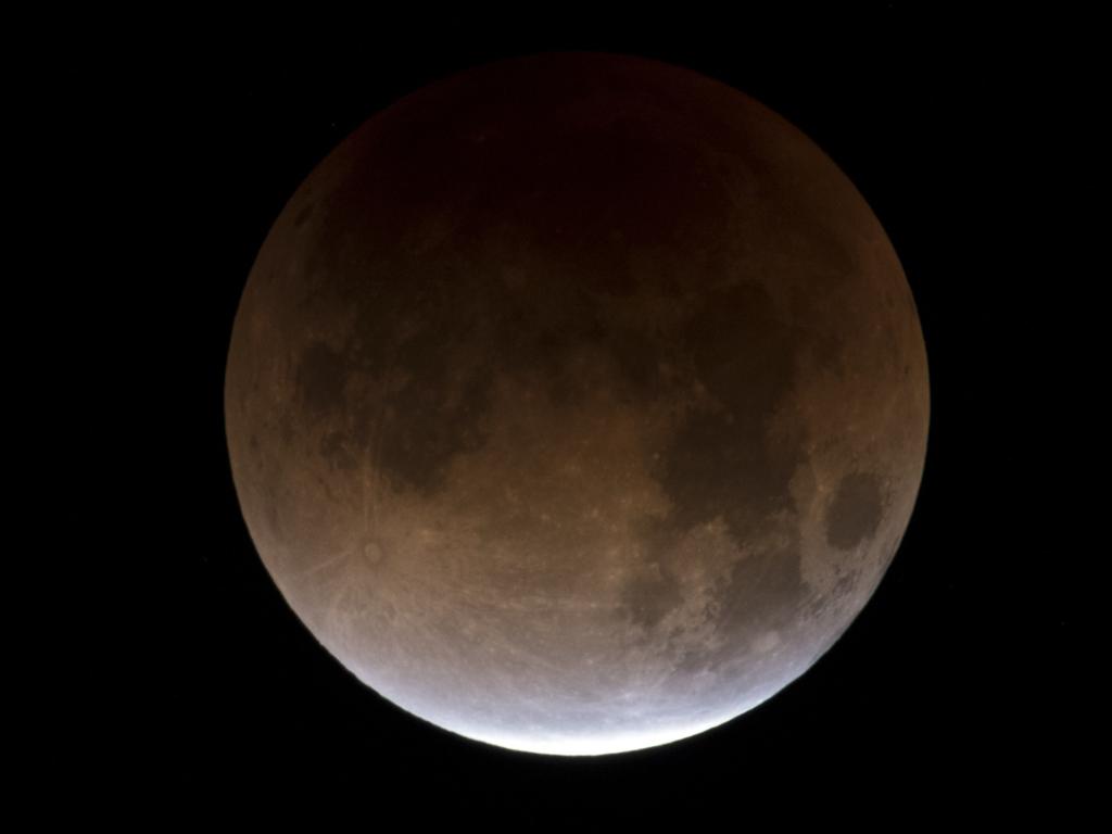 A partially eclipsed super blue blood moon is shown over the skies in Las Vegas, Wednesday, Jan. 31, 2018. It’s the first time in 35 years a blue moon has synced up with a supermoon and a total lunar eclipse. NASA is calling it a lunar trifecta: the first super blue blood moon since 1982. That combination won’t happen again until 2037. Picture AP