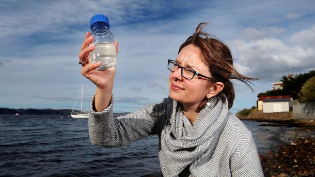 Ursula Taylor of the Derwent Estuary Program with a water sample in relation to a two year monitoring program of nutrients in the upper estuary of the Derwent River. Picture: NIKKI DAVIS-JONES