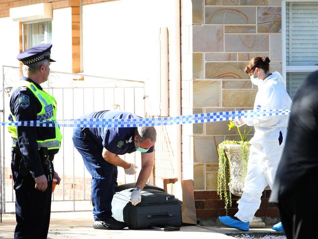 Police attend the scene of a murder at Rawson St, Alberton, in Adelaide, Sunday morning. Picture: Stephen Laffer