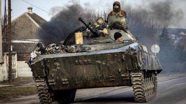 A Ukrainian tank steers its way on a road in Trostianets. Picture: AFP