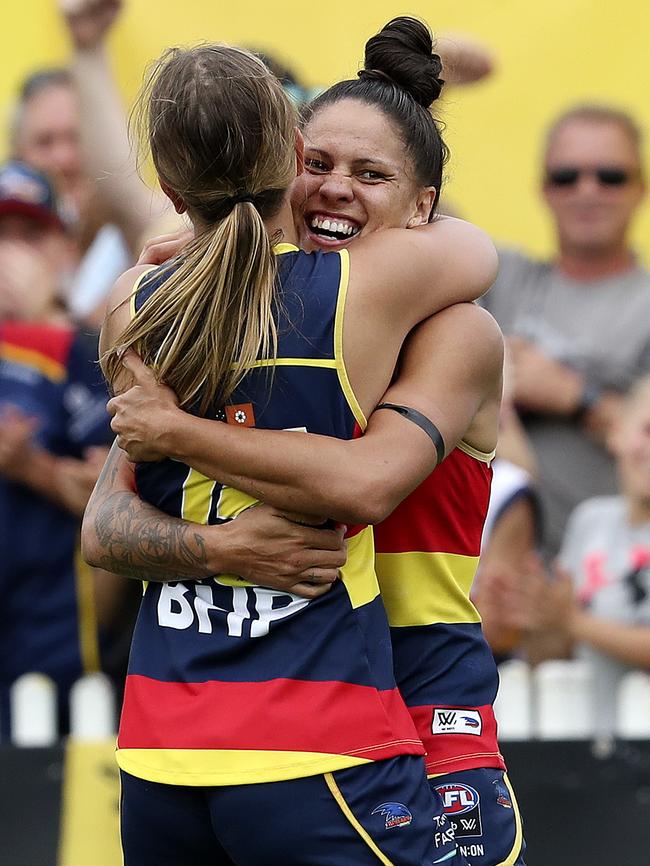 Last season’s AFLW leading goal-kicker Stevie-Lee Thompson celebrates a goal with Danielle Ponter. Picture: SARAH REED.