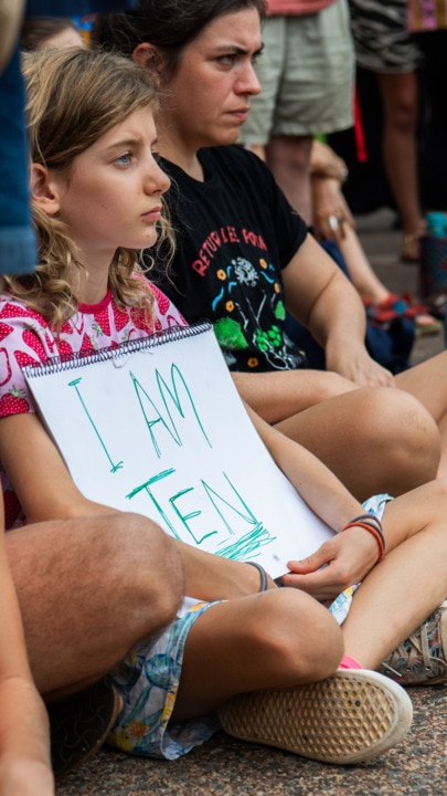 'Ten-year-olds don't belong in jail': Northern Territory community members have gathered outside Parliament