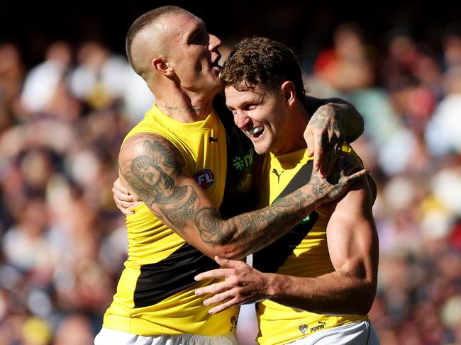 ADELAIDE, AUSTRALIA - MARCH 25: Jacob Hopper and Dustin Martin of the Tigers celebrate a goal during the 2023 AFL Round 02 match between the Adelaide Crows and the Richmond Tigers at Adelaide Oval on March 25, 2023 in Adelaide, Australia. (Photo by James Elsby/AFL Photos via Getty Images)