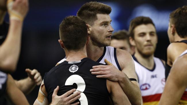 Bryce Gibbs and Marc Murphy shake hands after doing battle on opposition teams. Picture: AAP Images