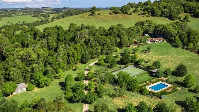 The property has an in-ground pool, tennis court, an artist studio, and its barn-style double garage incorporates a loft bedroom and bathroom, all set in Michael Bligh-designed gardens. Picture: Ray White