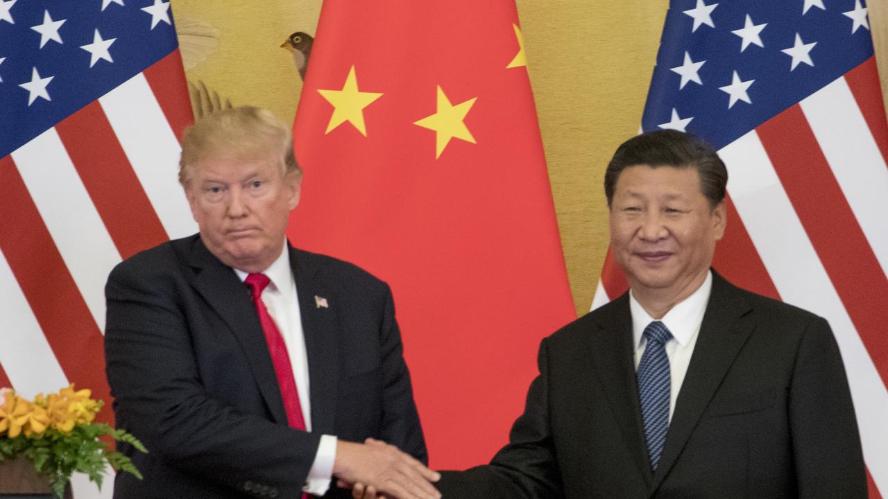 President Donald Trump and Chinese President Xi Jinping shake hands during a joint statement last year. Picture: Andrew Harnik