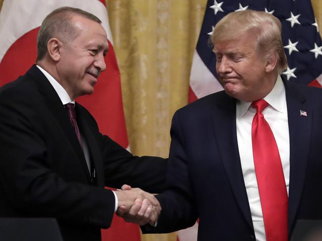 President Donald Trump (right) shakes hands with Turkish President Recep Tayyip Erdogan after a meeting at the White House in November last year. Picture: AP