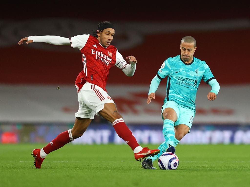 Arsenal's Gabonese striker Pierre-Emerick Aubameyang (L) vies for the ball against Liverpool's Spanish midfielder Thiago Alcantara (R) during the English Premier League football match between Arsenal and Liverpool at the Emirates Stadium in London on April 3, 2021. (Photo by Julian Finney / POOL / AFP) / RESTRICTED TO EDITORIAL USE. No use with unauthorized audio, video, data, fixture lists, club/league logos or 'live' services. Online in-match use limited to 120 images. An additional 40 images may be used in extra time. No video emulation. Social media in-match use limited to 120 images. An additional 40 images may be used in extra time. No use in betting publications, games or single club/league/player publications. /