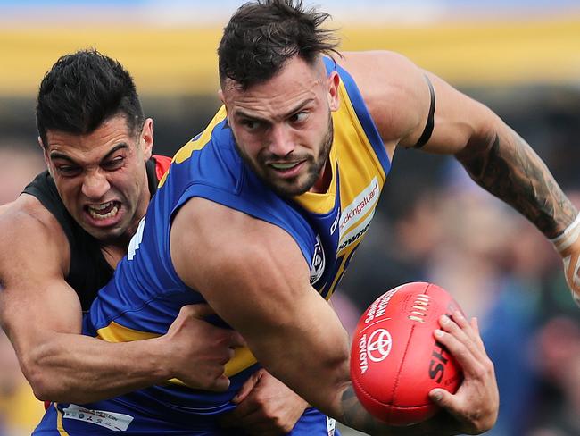 VFL Finals. Williamstown vs Essendon at Port Melbourne. 15/09/2019.  williamstowns Jake Greiser  clears by hand in the tackle   . Pic: Michael Klein.