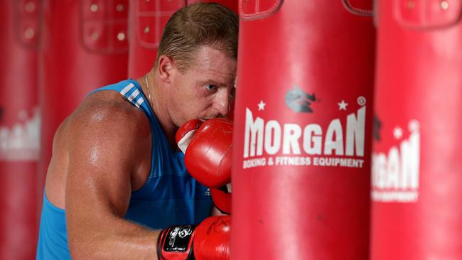 Michael Voss hitting the boxing bag in Queensland in 2014. Picture: Adam Head