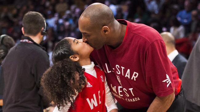 Kobe Bryant with his daughter Gigi at the basketball. Picture: Mark Blinch/The Canadian Press via AP