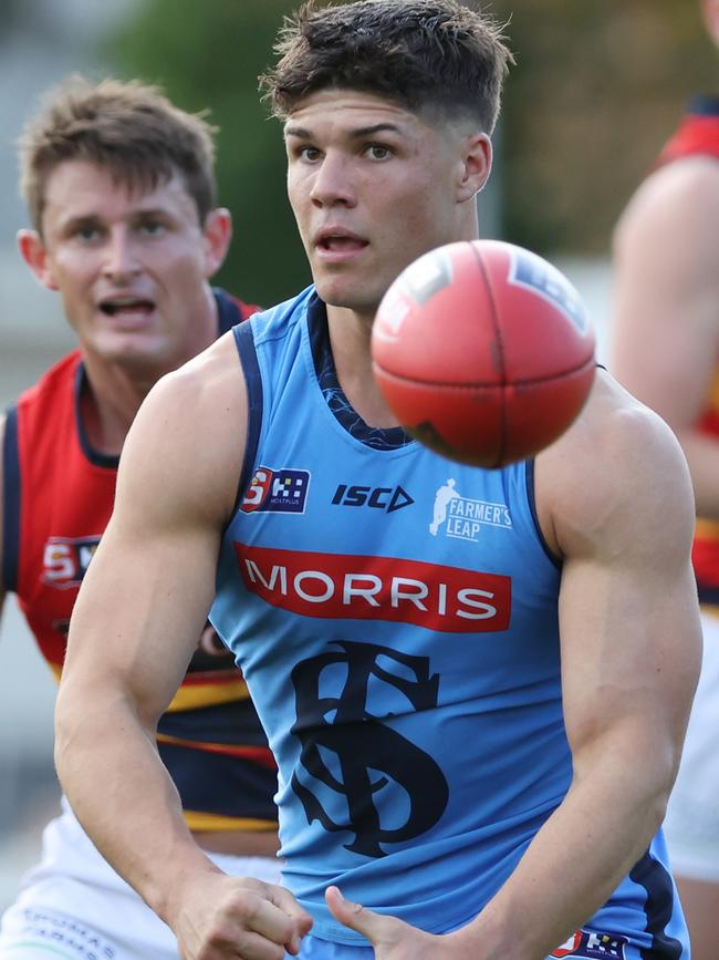 Sturt dynamo Tom Lewis flicks out a handpass against Adelaide on Saturday. Picture: SANFL Image/David Mariuz