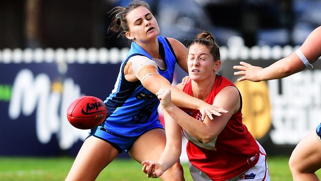 North Adelaide forward Kelly Barltrop attempts to get the handball away during the Roosters’ clash with Sturt at Peter Motley Oval on Saturday. Picture: AAP/Mark Brake