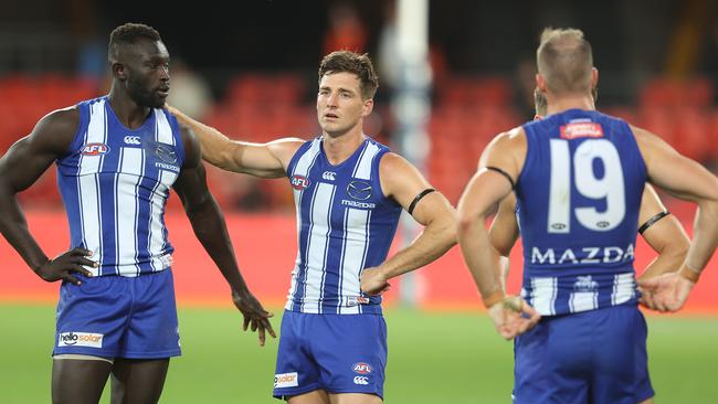 Majak Daw (left) and his teammates react after Sunday’s loss to Gold Coast. Picture: Chris Hyde/Getty Images