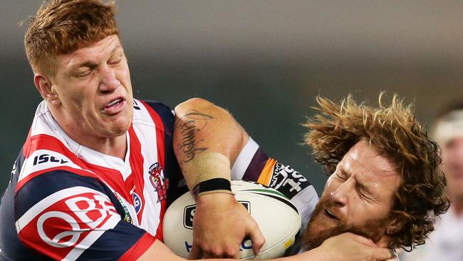 Dylan Napa (left) tackles Korbin Sims of the Broncos in Round 13. Photo: Getty Images