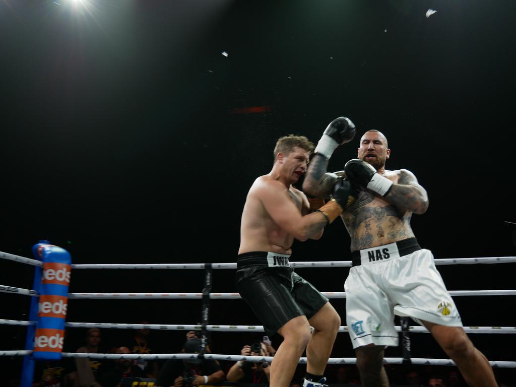 Nelson Asofa-Solomona lands an uppercut on Jarrod Wallace at the Battle of the Reef fight night at the Townsville Entertainment and Convention centre, October 7 2023. Picture: Blair Jackson.