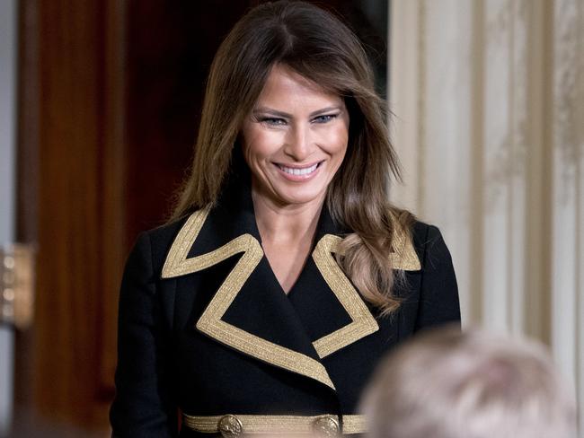 First lady Melania Trump was all smiles before the news conference. Picture: AP Photo/Andrew Harnik