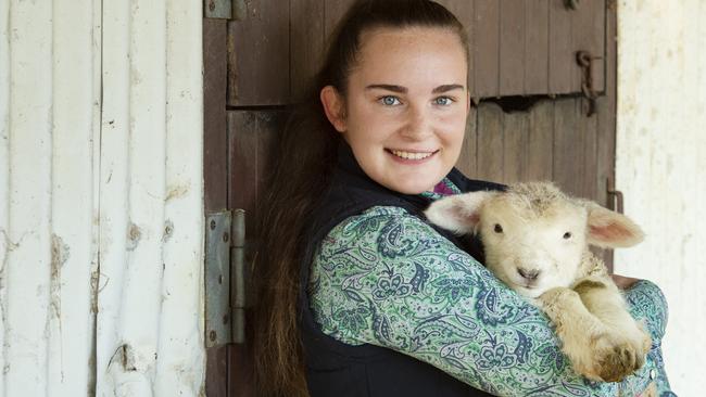 Erin Douglas is pleading for the safe return of a two and a half week old lamb, stolen from a Tyabb property on Friday. Picture: Zoe Douglas