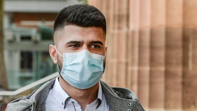 Mahdi Al Haiery leaves the Adelaide Magistrates Court after pleading guilty to serving up pizza with shards of broken glass among the toppings. Picture: NCA NewsWire / Brenton Edwards