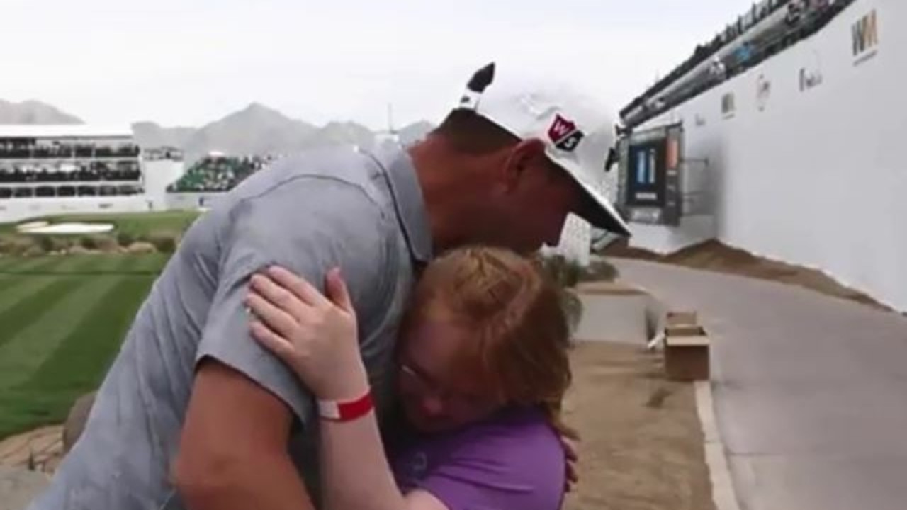 Gary Woodland hugs Amy Bockerstette.
