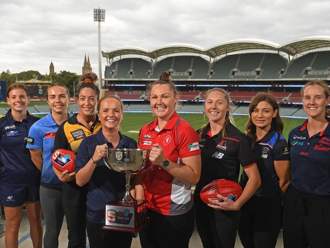 23/02/21 - SANFLW captains at the 2021 season launch at Adelaide Oval. Eagles Anni Falkenberg, Sturt Maya Rigter, Glenelg Ellie Kellock, South Elyse Haylock, Norths Krisit Harvey, Wests Bec Owen, Central Shelby Smith and Norwoods Alison Ferrall. Picture: Tom Huntley