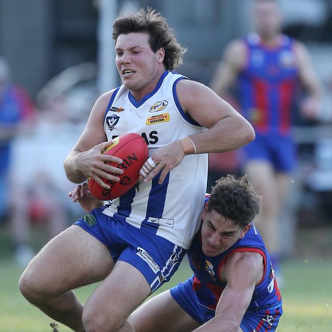 Yackandandah’s Johann Jarratt holds onto a mark in front of Beechworth’s Jordan Eaton.