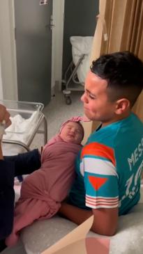 Heartwarming moment brother meets his little sister for the first time