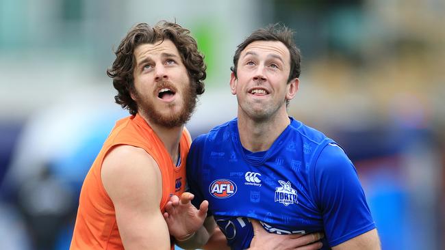 Todd Goldstein and Tristan Xerri battle for position at North Melbourne training.