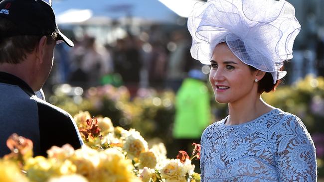 Melbourne Cup-winning jockey Michelle Payne talks to fans as she departs Flemington. Picture: Jay Town