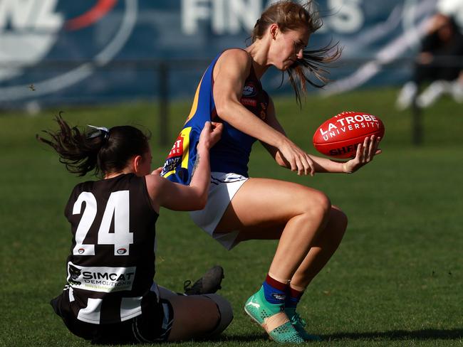 Brieanna Musgrave of Banyule is tackled by Montmorency’s Trinity Garraway. Picture: Hamish Blair