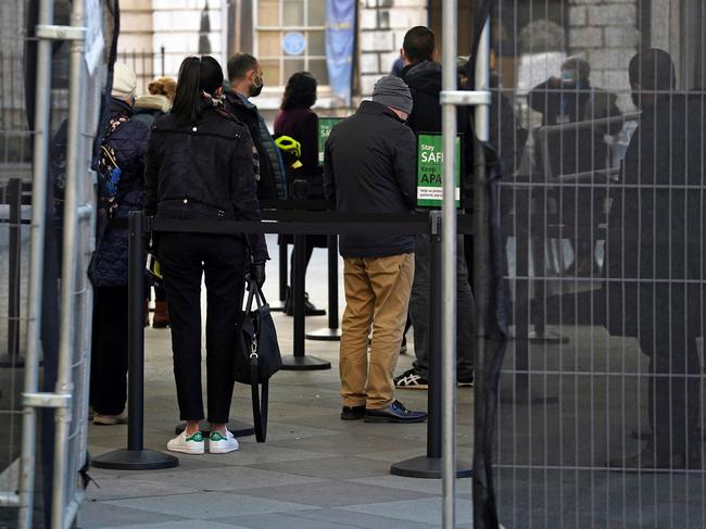 People queue at the London Bridge COVID-19 vaccination centre. Picture: AFP