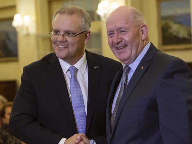 Scott Morrison is congratulated by the Governor General Sir Peter Cosgrove after been sworn in at Government House. Picture: AP