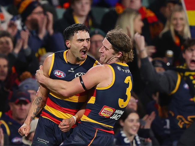 Izak Rankine of the Crows celebrates a goal wth Sam Berry during the 2024 AFL Round 16 match. (Photo by Sarah Reed/AFL Photos via Getty Images)